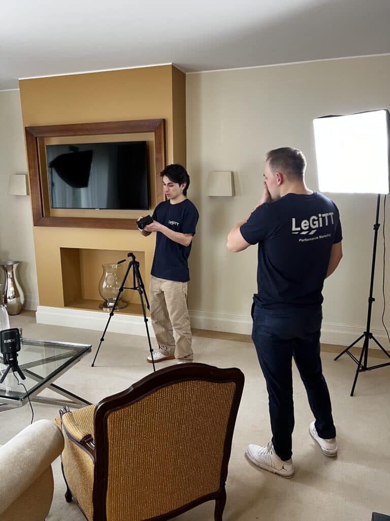 video production set with two men wearing LeGiTT shirts and multiple softboxes